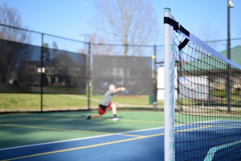 An image of a Boy Playing Pickleball.
