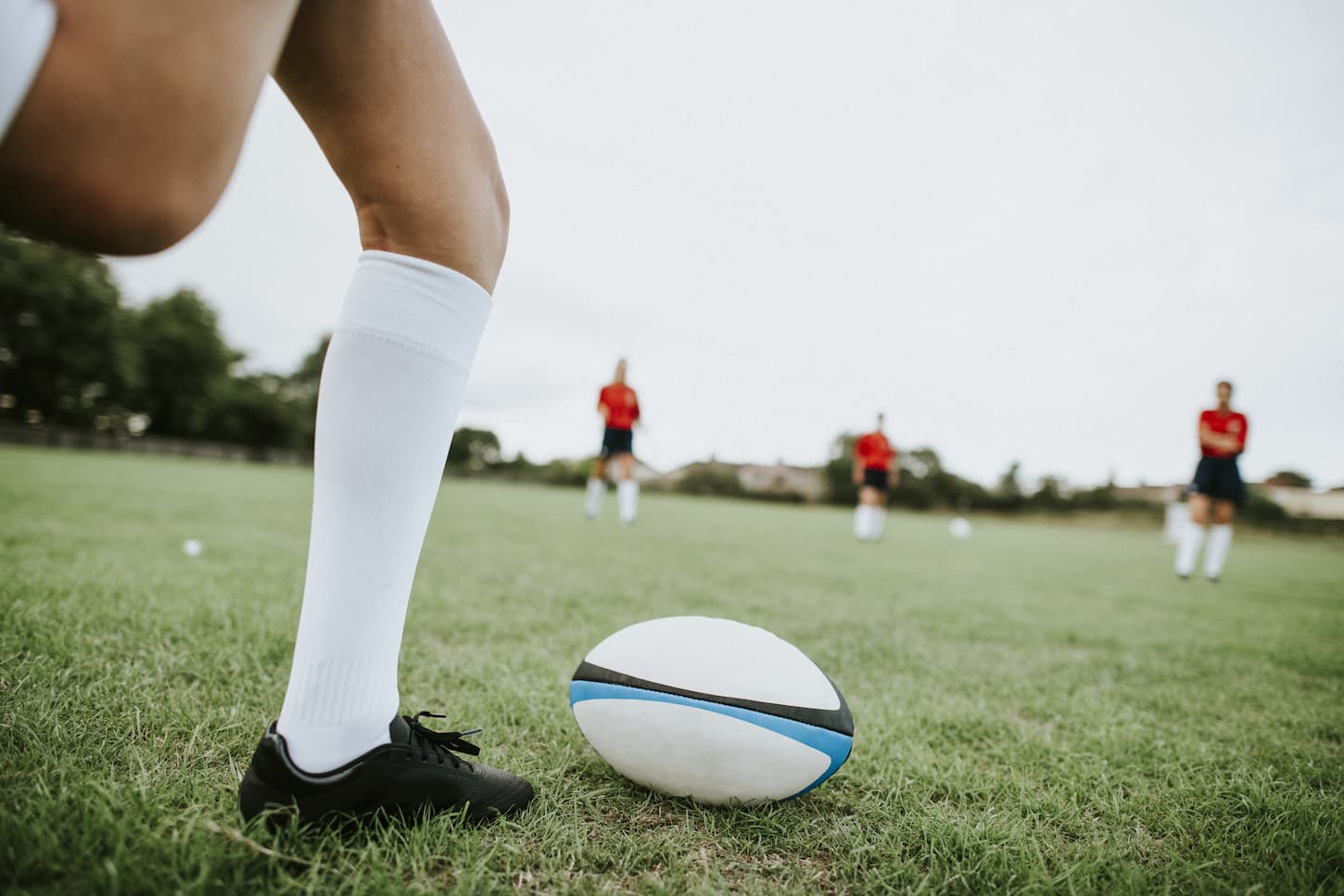 An image of Female rugby players on the field.