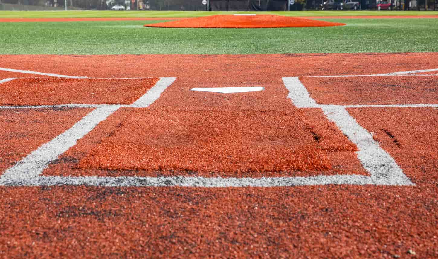 An image of a baseball field looking out from the home plate.