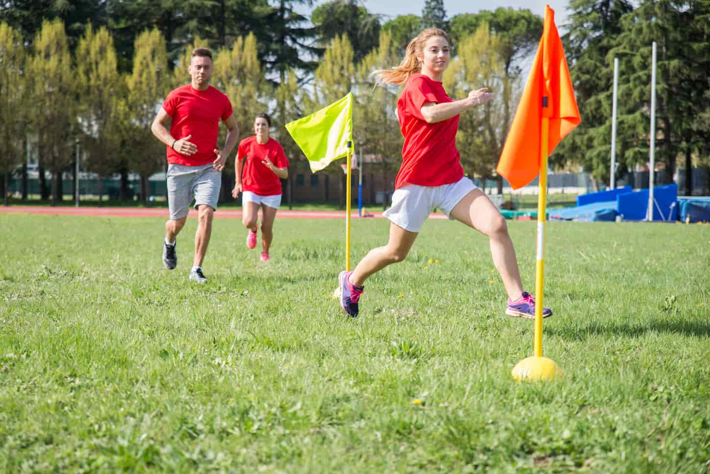 An image of Football players training on the soccer field.