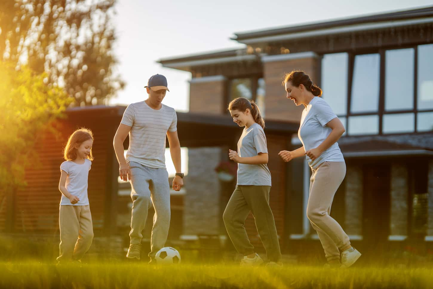 An image of a Happy family playing soccer.