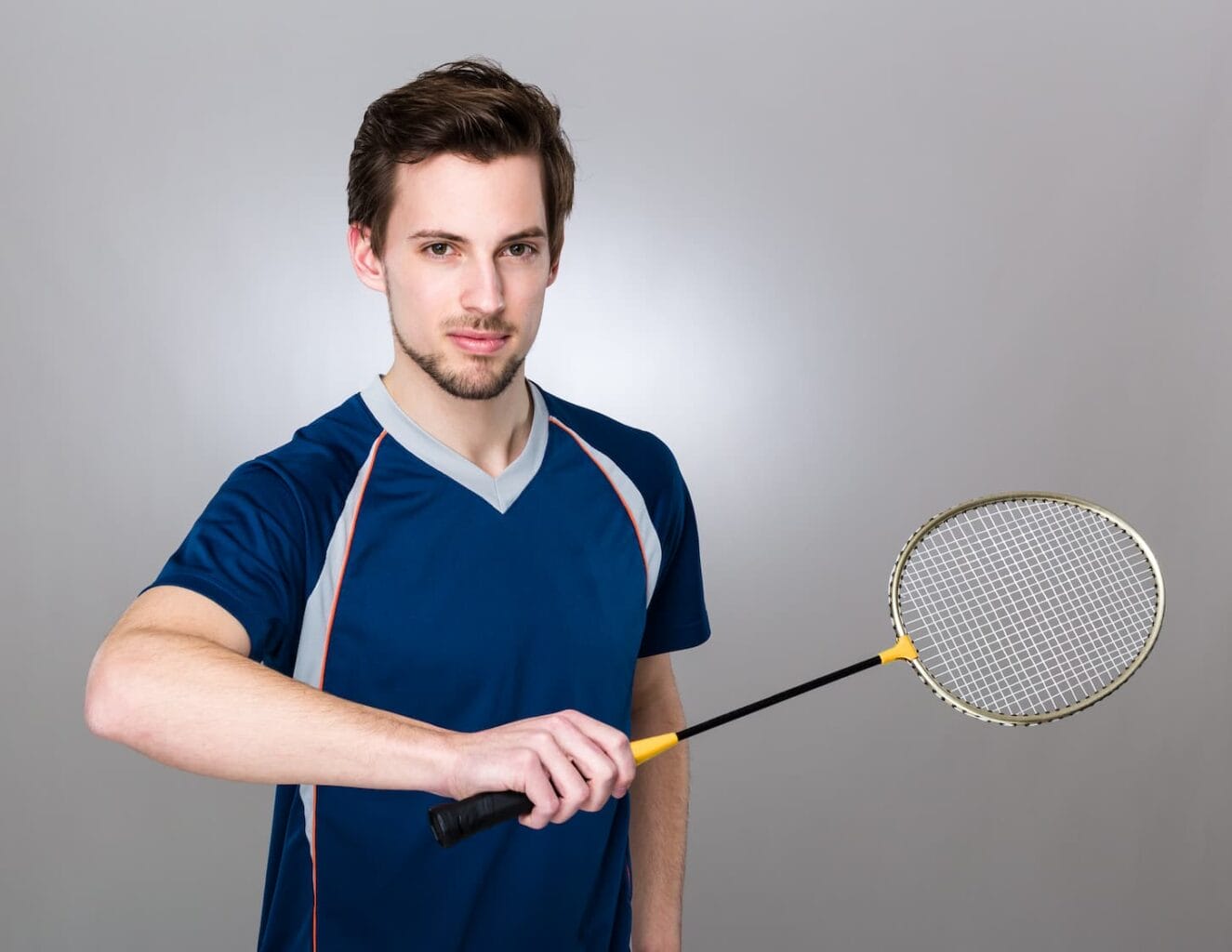 An image of a Sportsman holding a badminton racket.